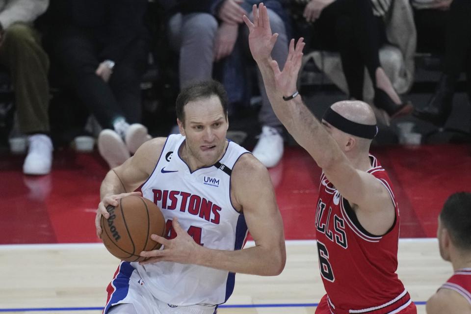 Chicago Bulls Alex Caruso, center, guards Detroit Pistons Bojan Bogdanovic, left, during the NBA basketball game between Chicago Bulls and Detroit Pistons at the Accor Arena in Paris, Thursday, Jan. 19, 2023.