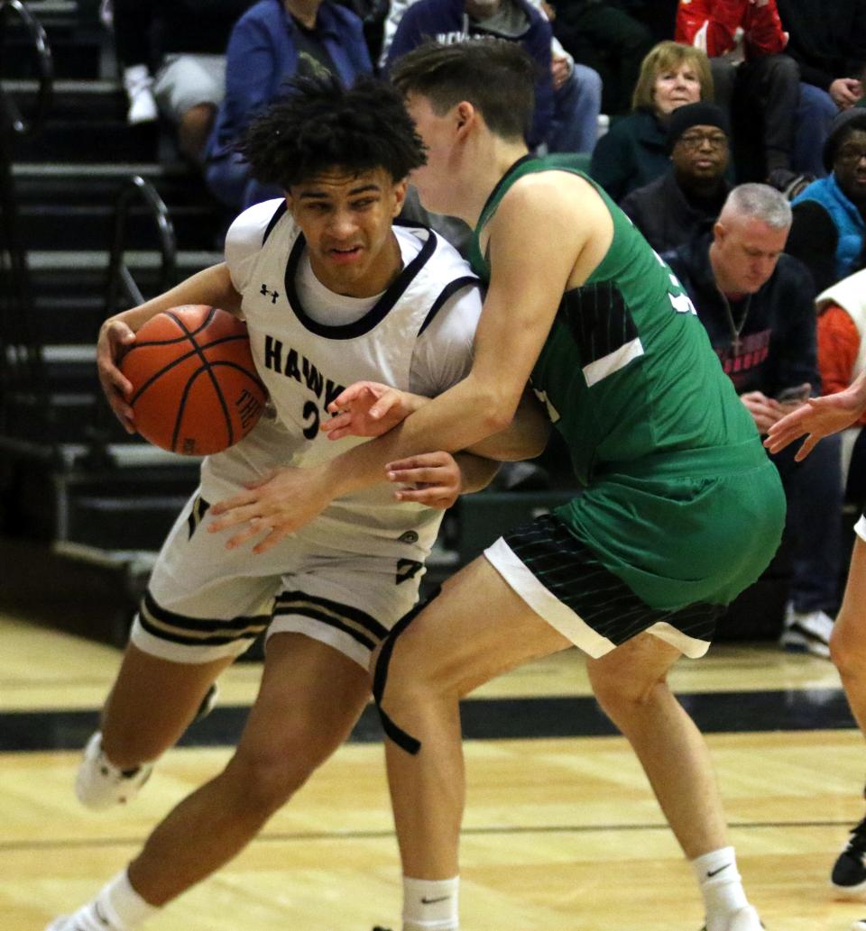 Corning's Isaiah Henderson drives to the basket during a 74-63 overtime win against Binghamton Seton Catholic Central in the Boys Regional Division 2 championship game at the Josh Palmer Fund Clarion Classic on Dec. 30, 2022 at Elmira High School.