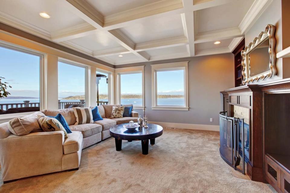 A view of a coffered wall in a large living room.