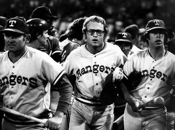 Texas Rangers manager Billy Martin, left, and players Jeff Burroughs, center, and Joe Lovitto, right, prepare to defend themselves during the fan riot of the infamous 10-cent beer night game on June 4, 1974, at Cleveland Stadium.