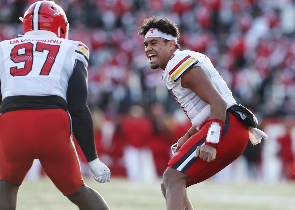 Maryland quarterback Taulia Tagovailoa celebrates with lineman Sam Okuayinonu after a defensive stop against Rutgers.