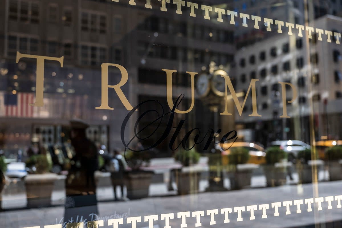 A security guard reflected in the glass as he patrols outside Trump Tower (AFP/Getty)