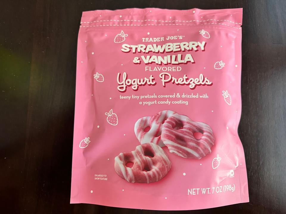 Trader Joe's strawberry and vanilla dipped yogurt pretzels bag, pink package with pink and white striped pretzels on the front