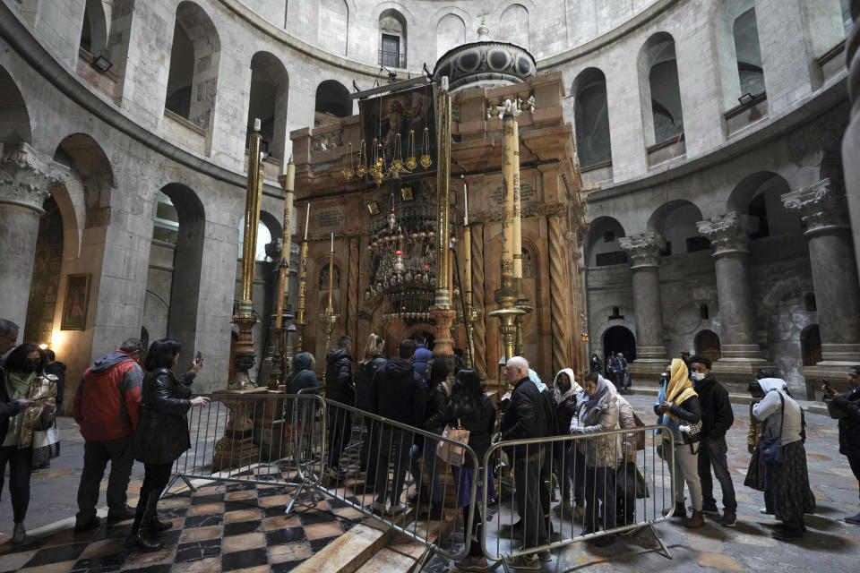 People line up to visit the ridicule at the Church of the Holy Sepulchre, where many Christians believe Jesus was crucified, buried and rose from the dead, in the Old City of Jerusalem, Thursday, March 17, 2022. The three Christian communities that have uneasily shared their holiest site for centuries are embarking on a project to restore the ancient stone floor of the Jerusalem basilica. The project includes an excavation that could shed light on the rich history of the Church of the Holy Sepulchre in the Old City. (AP Photo/Mahmoud Illean)