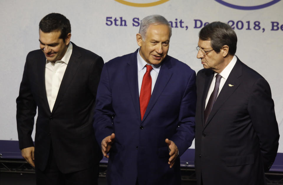 Greek Prime Minister Alexis Tsipras, left, Israeli Prime Minister Benjamin Netanyahu, center, and Cypriot President Nicos Anastasiades, right, meet during the 5th trilateral summit with Israel, Greece and Cyprus in Beersheba, Israel, Thursday, Dec. 20, 2018. (AP Photo/Ariel Schalit)