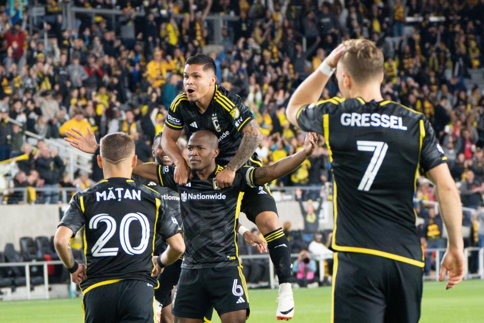 Oct 21, 2023; Columbus, Ohio, USA;
Columbus Crew forward Cucho Hernández (9) jumps on Columbus Crew midfielder Darlington Nagbe’s (6) back after he scored their second goal against the CF Montréal during their game on Saturday, Oct. 21, 2023 at Lower.com Field.