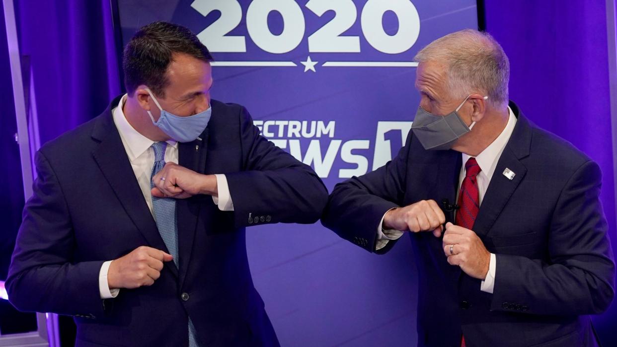 Mandatory Credit: Photo by Gerry Broome/AP/Shutterstock (10826400u)Democratic challenger Cal Cunningham, left, and U.