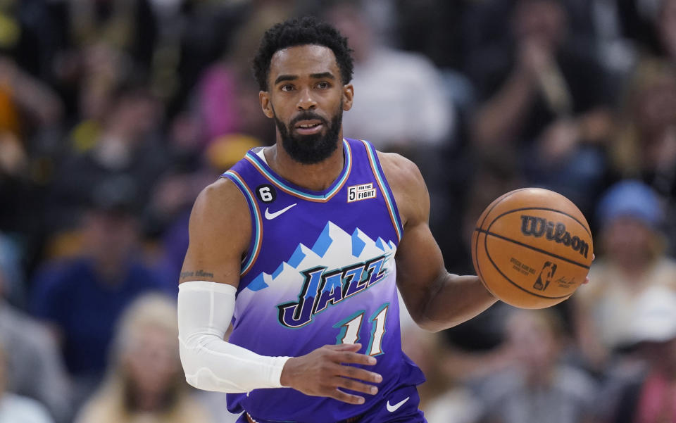 FILE - Utah Jazz guard Mike Conley brings the ball up during the second half of the team's NBA basketball game against the Philadelphia 76ers on Jan. 14, 2023, in Salt Lake City. As part of a three-team trade, the Minnesota Timberwolves are getting Conley and Nickeil Alexander-Walker from Utah along with three second-round picks, while the Los Angeles Lakers are sending Juan Toscano-Anderson, Damian Jones and their first-round pick in 2027 to Utah with Russell Westbrook, a person with knowledge of the trade told The Associated Press. (AP Photo/Rick Bowmer, File)