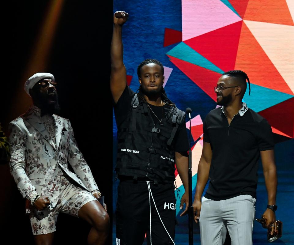 KB, center, accepts the Rap/Hip Hop Album of the Year Award during the 52nd GMA Dove Awards on Tuesday, October 19, 2021, in Nashville, Tenn. 