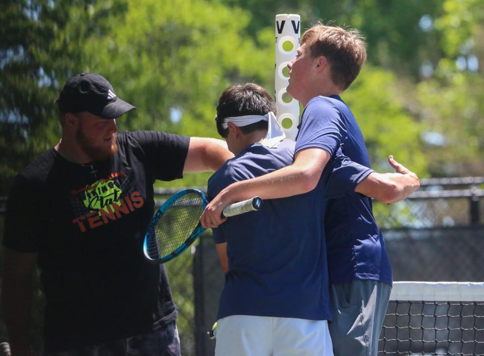 Hayden's Joseph Luke and Chase Blaser celebrate after claiming fifth place in the Class 3-1A State Tennis Tournament in Prairie Village on Saturday, May 11.