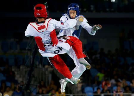 2016 Rio Olympics - Taekwondo - Men's -68kg Gold Medal Finals - Carioca Arena 3 - Rio de Janeiro, Brazil - 18/08/2016. Ahmad Abughaush (JOR) of Jordan competes against Alexey Denisenko (RUS) of Russia. REUTERS/Peter Cziborra