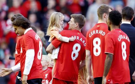Football - Liverpool v Crystal Palace - Barclays Premier League - Anfield - 16/5/15 Liverpool's Steven Gerrard walks on the pitch with his family after his final game at Anfield. REUTERS/Phil Noble