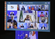 European Council President Charles Michel, on screen bottom, participates in a virtual G20 meeting, hosted by Saudi Arabia, at the European Council building in Brussels, Saturday, Nov. 21, 2020. (Yves Herman, Pool via AP)