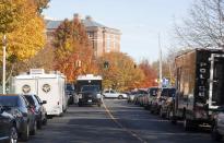 Law enforcement vehicles line the streets to Central Connecticut State University while it is in lockdown in New Britain, Connecticut Monday November 4, 2013. A person has been taken into custody at Central Connecticut State University on Monday after officials locked down the campus when a suspicious person, possibly armed, was spotted, said New Britain Mayor Tim O'Brien. Citing students, local media said police had searched for a person who appeared to be carrying a gun and what looked like a sword. (REUTERS/Michelle McLoughlin)