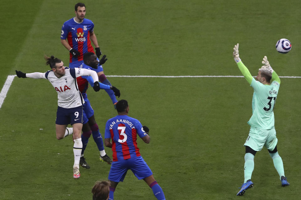 Tottenham's Gareth Bale, left, scores his side's second goal during the English Premier League soccer match between Tottenham Hotspur and Crystal Palace at the Tottenham Hotspur Stadium in London, Sunday, March 7, 2021. (Julian Finney/Pool via AP)