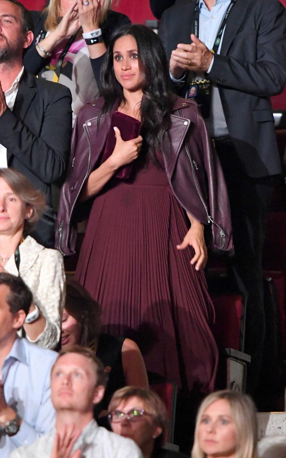 Meghan wearing the Aritzia dress and Mackage jacket which Jessica Mulroney helped her to pick for the Invictus Games - Wireimage