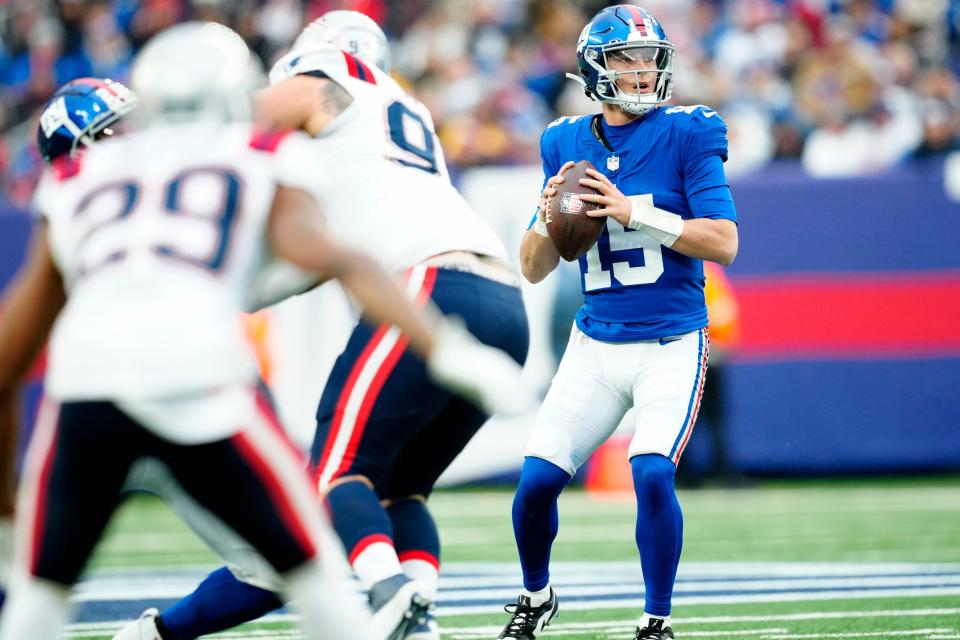 New York Giants quarterback <a class="link " href="https://sports.yahoo.com/nfl/players/40533" data-i13n="sec:content-canvas;subsec:anchor_text;elm:context_link" data-ylk="slk:Tommy DeVito;sec:content-canvas;subsec:anchor_text;elm:context_link;itc:0">Tommy DeVito</a> (15) looks for an open teammate, Sunday, November 26, 2023.