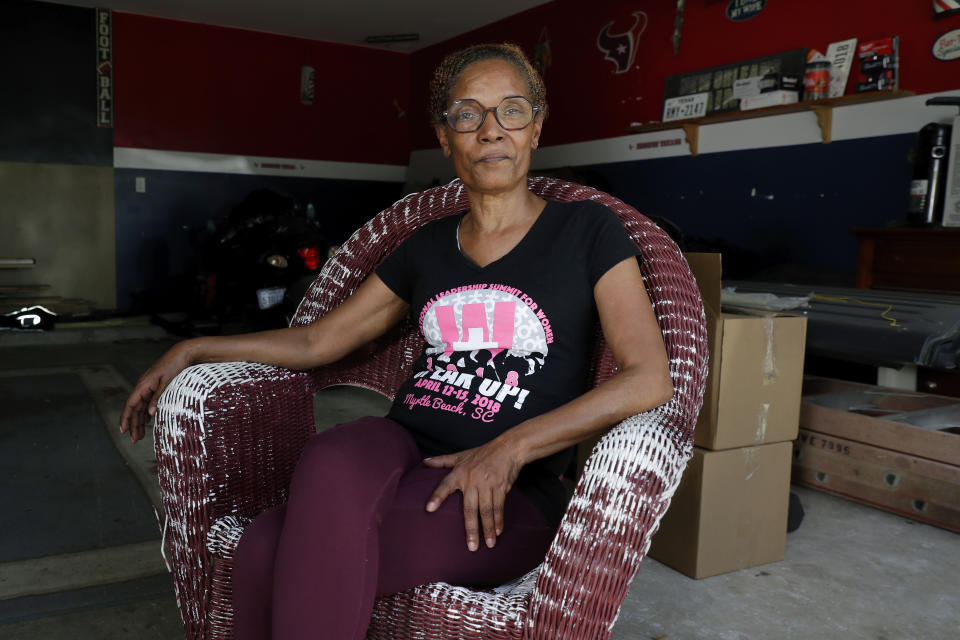 Tana Pradia, a poll watcher in Harris County, poses for a photo at her home on Wednesday, July 26, 2023, in Houston. (AP Photo/Michael Wyke)