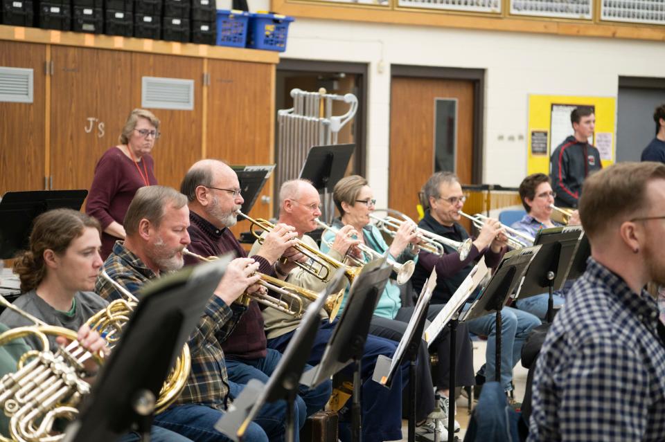 Brass players rehearse with the Cereal City Concert Band at Battle Creek Central High School on Monday, March 11, 2024.