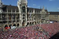 FILE PHOTO: Tens of thousands of enthusiastic Bayern fans congregate in downtown Munich on the famous Marienplatz to celebrate the club's double-winning season.