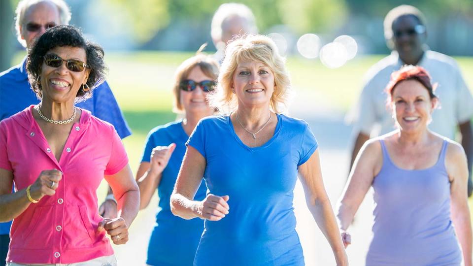 Group of women walking outside in park