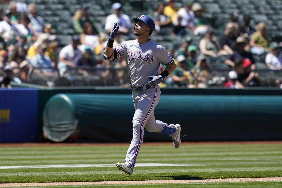 Texas Rangers' Joey Gallo gestures after hitting a two-run home run against the Oakland Athletics during the seventh inning of a baseball game in Oakland, Calif., Thursday, July 1, 2021. (AP Photo/Jeff Chiu)