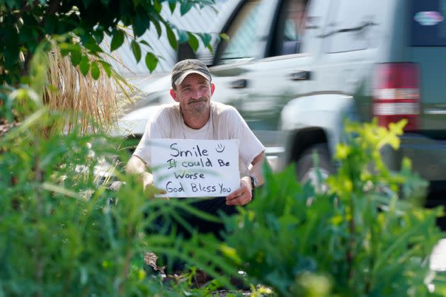 Sean Fuller, who is homeless, panhandles at the entrance to a store on May 10, 2022, in Cookeville, Tenn. Tennessee is about to become the first U.S. state to make it a felony to camp on local public property such as parks. (AP Photo/Mark Humphrey) (Photo: via Associated Press)
