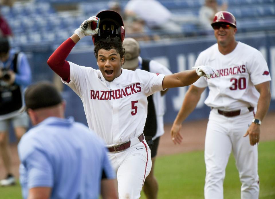 Arkansas batter Kendall Diggs celebrates after hitting the walk-off solo homer in extra innings to down Texas A&M 6-5 during the second round of the SEC Baseball Tournament at the Hoover Met Wednesday, May 24, 2023.
