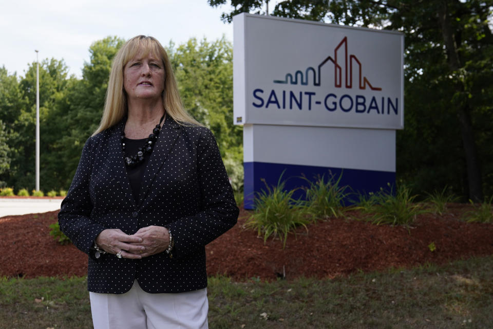 In this Friday, Aug. 14, 2020, photo New Hampshire Rep. Nancy Murphy, D-Merrimack, poses for a photo outside the Saint-Gobain plastics factory in Merrimack, N.H. (AP Photo/Charles Krupa)