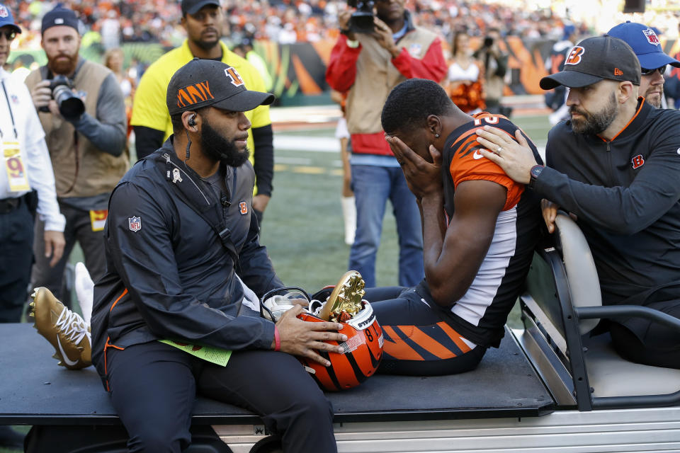 Cincinnati Bengals wide receiver A.J. Green, center, is carted off the field after sustaining an injury in the first half of an NFL football game against the Denver Broncos, Sunday, Dec. 2, 2018, in Cincinnati. (AP Photo/Frank Victores)