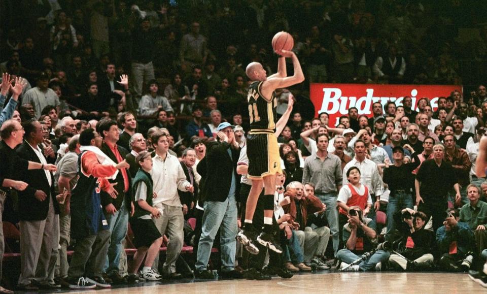 Indiana Pacers' Reggie Miller shoots a three-pointer with 5.1 seconds left in regulation to tie Game 4 of the Eastern Conference semifinals with the New York Knicks at Madison Square Garden in New York Sunday, May 10, 1998. The Pacers went on to win the game 118-107 and take a 3-1 lead with Game 5 in Indianapolis Wednesday.