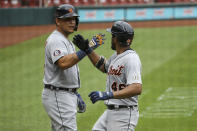 Detroit Tigers' Miguel Cabrera, left, congratulates teammate Jeimer Candelario after Candelario hit a two-run home run during the fourth inning in the first game of a baseball doubleheader against the St. Louis Cardinals Thursday, Sept. 10, 2020, in St. Louis. (AP Photo/Scott Kane)