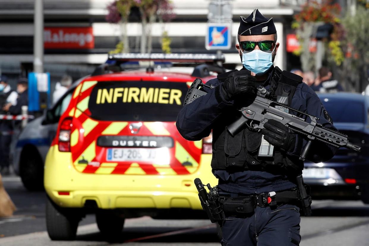 Image: A security officer guards the area after a reported knife attack at Notre Dame church in Nice, France (Eric Gaillard / Reuters)