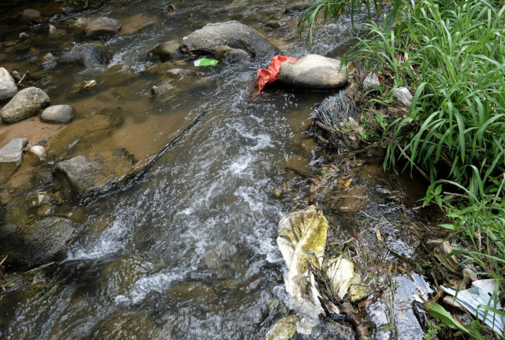 File picture of trash in Sungai Ichat. — Bernama pic