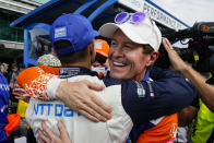 Scott Dixon, of New Zealand, right, celebrates winning the pole with second place finisher Alex Palou, of Spain, during qualifications for the Indianapolis 500 auto race at Indianapolis Motor Speedway in Indianapolis, Sunday, May 22, 2022. (AP Photo/Michael Conroy)