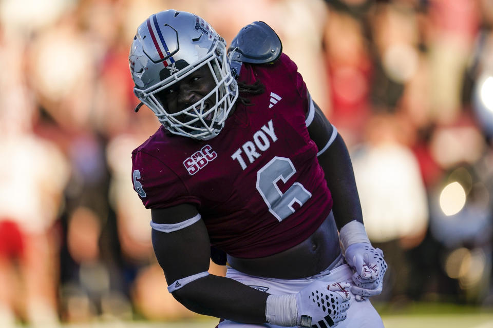 Troy linebacker Javon Solomon (6) reacts to his sacking of Louisiana-Lafayette quarterback Chandler Fields during the first half of an NCAA college football game, Saturday, Nov. 18, 2023, in Troy, Ala. (AP Photo/Mike Stewart)