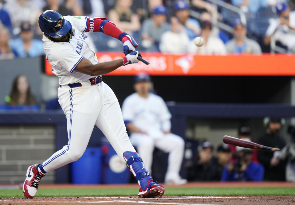 Toronto Blue Jays' Vladimir Guerrero Jr. (27) hits a broken-bat RBI double against the New York Yankees during the first inning of a baseball game Thursday, June 27, 2024, in Toronto. (Frank Gunn/The Canadian Press via AP)