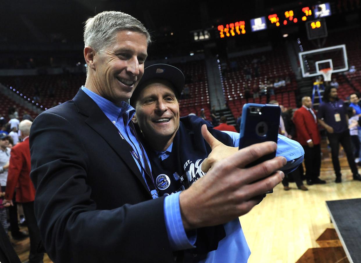 Nevada men’s basketball head coach Eric Musselman, right, and athletic director Doug Knuth take a selfie after the team beat Colorado State to win the Mountain West Conference tournament in Las Vegas in 2017.