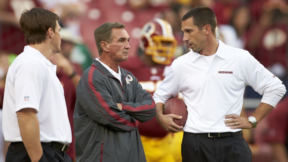 Washington Redskins coach Mike Shanahan with offensive coordinator and son Kyle Shanahan (right) during a game against the Philadelphia Eagles in 2013. - Simon Bruty/Sports Illustrated/Getty Images