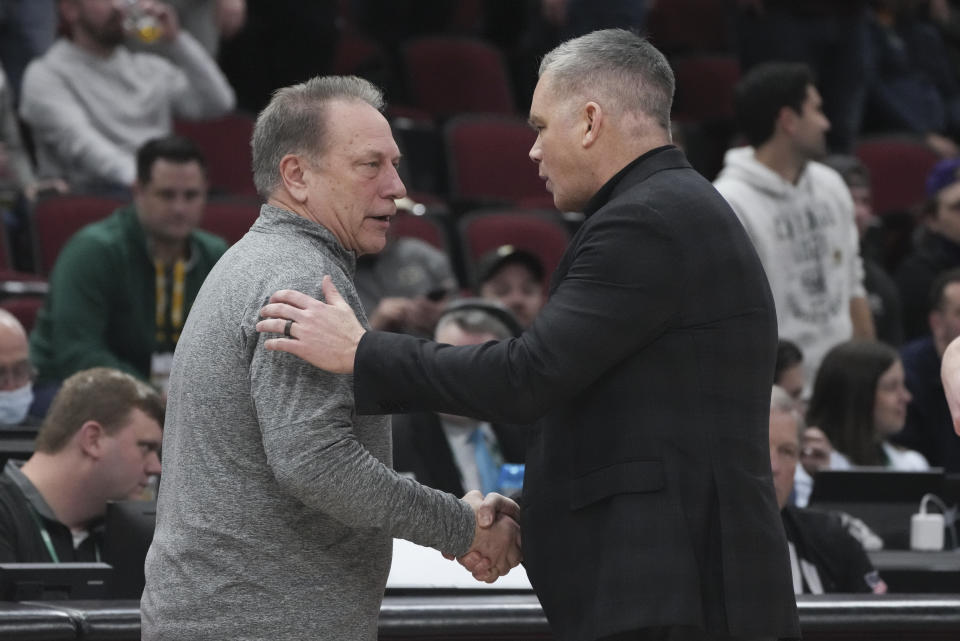 Michigan State's head coach Tom Izzo and Ohio State's head coach Chris Holtmann shake hands after an NCAA college basketball game at the Big Ten men's tournament, Friday, March 10, 2023, in Chicago. Ohio State won 68-58. (AP Photo/Erin Hooley)