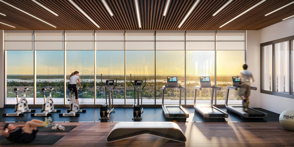 Aura’s 400-plus-square-foot yoga studio is located within the tower’s 1,800-square-foot fitness center which features floor to ceiling windows which maximize the incredible aerial views.