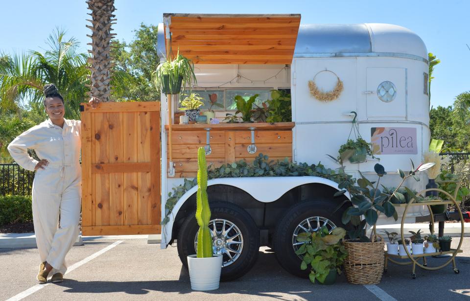 Taylor Robinson owns and operates Pilea Plants & Things, a mobile plant shop.  She uses a converted horse trailer to hold pop-up events for plant lovers. 