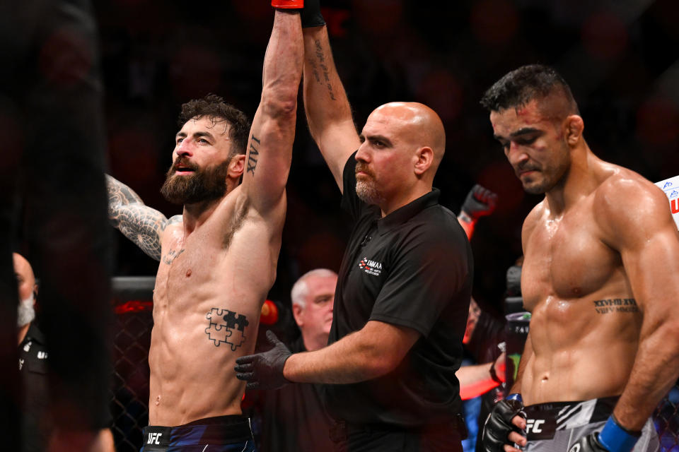 Jul 22, 2023; London, UNITED KINGDOM; Paul Craig (red gloves) reacts to defeating Andre Muniz (blue gloves) during UFC Fight Night at O2 Arena. Mandatory Credit: Per Haljestam-USA TODAY Sports