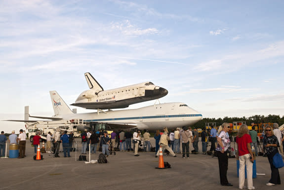 Media representatives are given the opportunity to photograph space shuttle Endeavour, secured atop NASA's Shuttle Carrier Aircraft or SCA, at the Shuttle Landing Facility at NASA's Kennedy Space Center in Florida on Sunday (Sept. 16, 2012). T