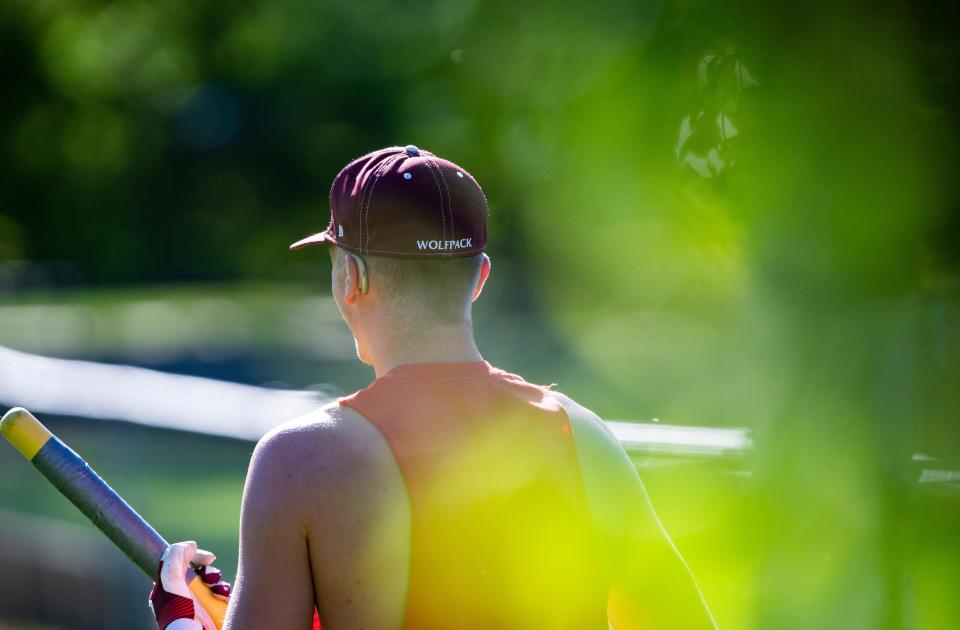 Western Christian senior Ty Van Essen warms up with a whiffle bat during practice at the high school on June 16 in Hull.