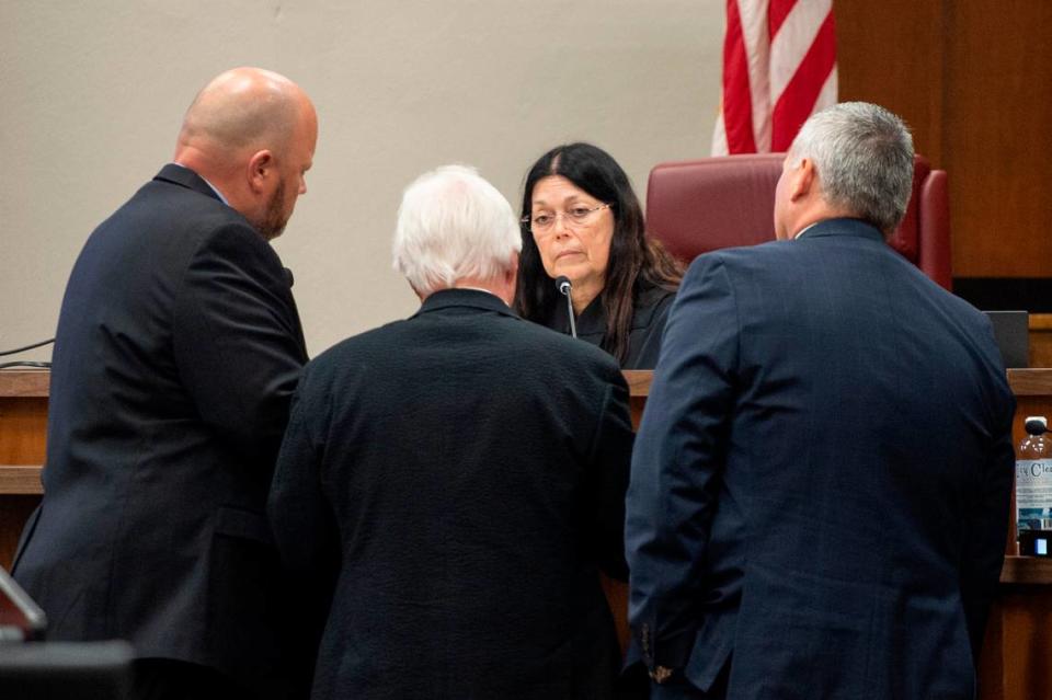 Prosecution and defense attorneys meet with Judge Lisa Dodson during day one of the trial of Johnny Max Mount for the 2015 murder of Julie Brightwell in Harrison County Court in Biloxi on Tuesday, June 13, 2023.