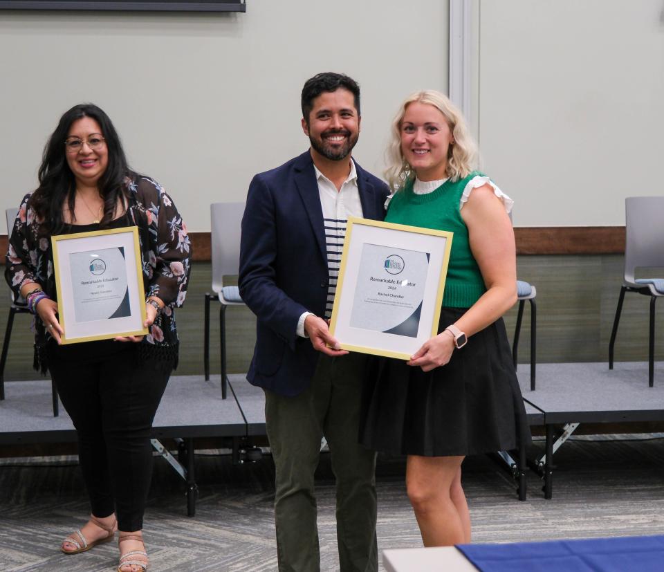 Rachel Chandler receives a Remarkable Educator Award from Chris McGilvery at the Leaders Readers Network Teacher Appreciation Event on May 9 in Amarillo.