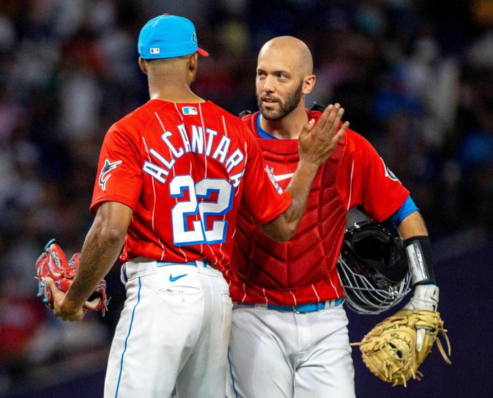 Miami Marlins pitcher Sandy Alcantara (22) and catcher Jacob Stallings (58) react to defeating the Los Angeles Dodgers 2-1 in nine innings of an MLB game at loanDepot park in the Little Havana neighborhood of Miami, Florida, on Saturday, August 27, 2022.