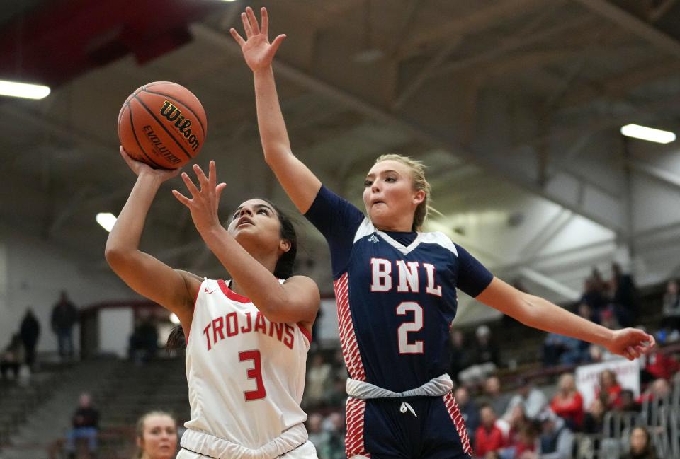 Bedford North Lawrence Star Chloe Spreen (2) tries to stop a shot by Center Grove Trojan Aubrie Booker (3) on Saturday, Feb. 18, 2023, during the 4A semistate game at Southport High School in Indianapolis. Bedford North Lawrence defeated Center Grove, 50-43, advancing to semistate finals.