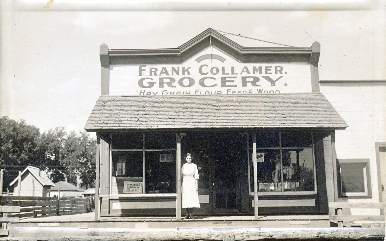 Frank Collamer's daughter Minerva (Collamer) Stoneburner stands outside her father's grocery store at 313 N. Meldrum St. The building was later run by Stoneburner's sister, Emma Malaby, until 1943.